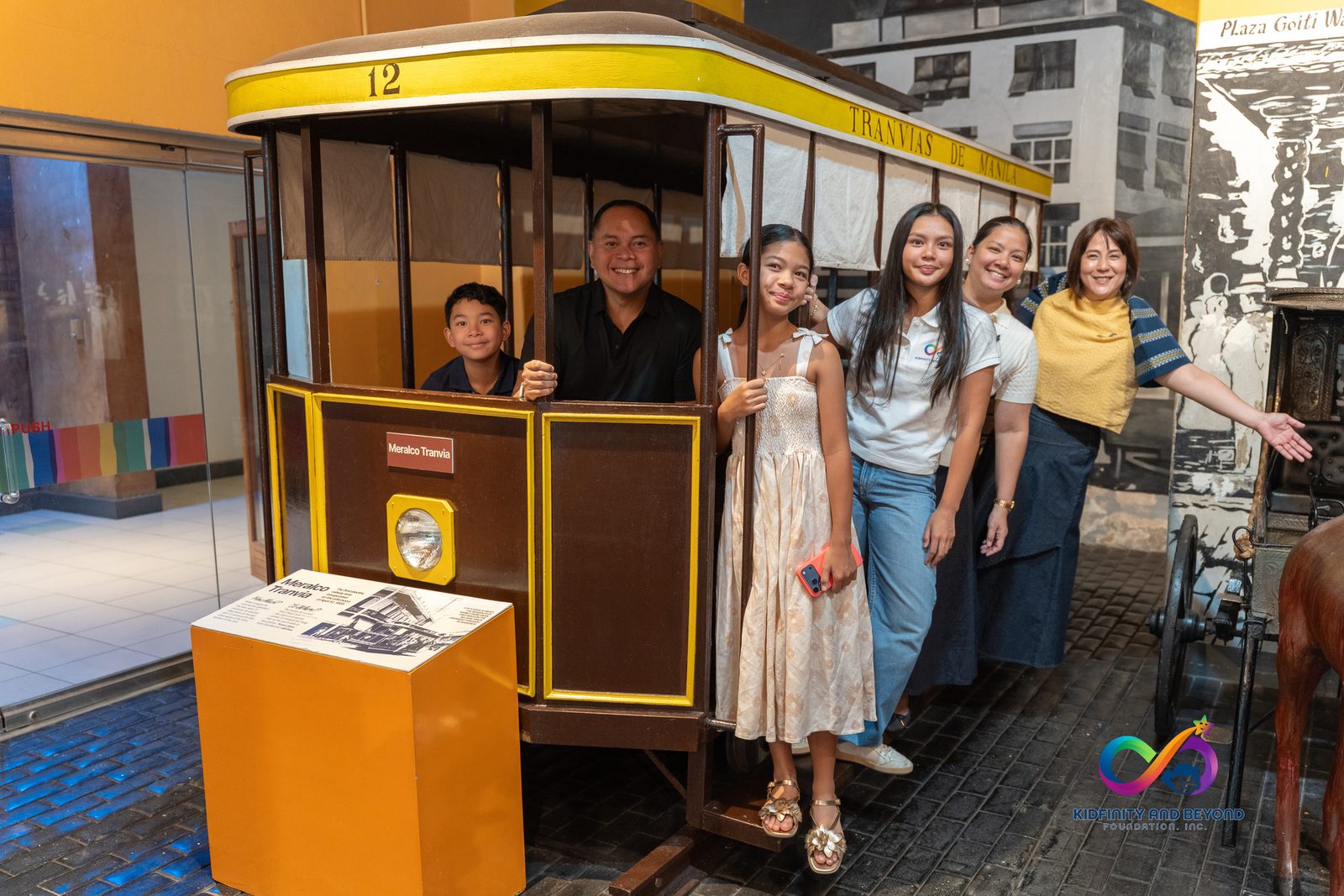 The Foundation’s delegation stands beside a vintage tranvia exhibit inside Museo Pambata.